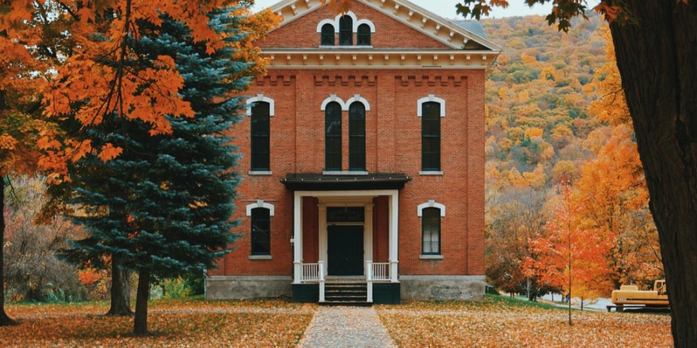 A picture of an orange brick house
